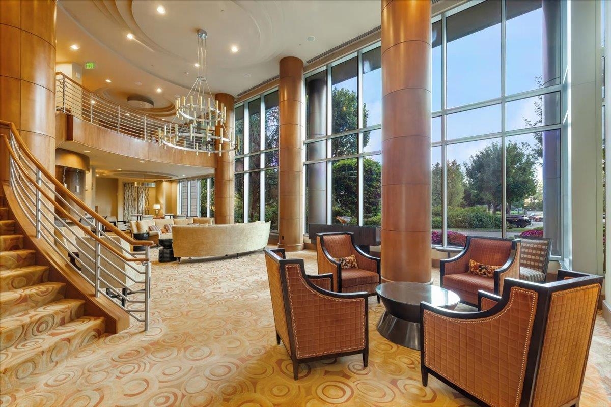 8100 River Road, Unit 209 North Bergen, NJ 07047 - Photo 41 of 42 a lobby with furniture and floor to ceiling windows