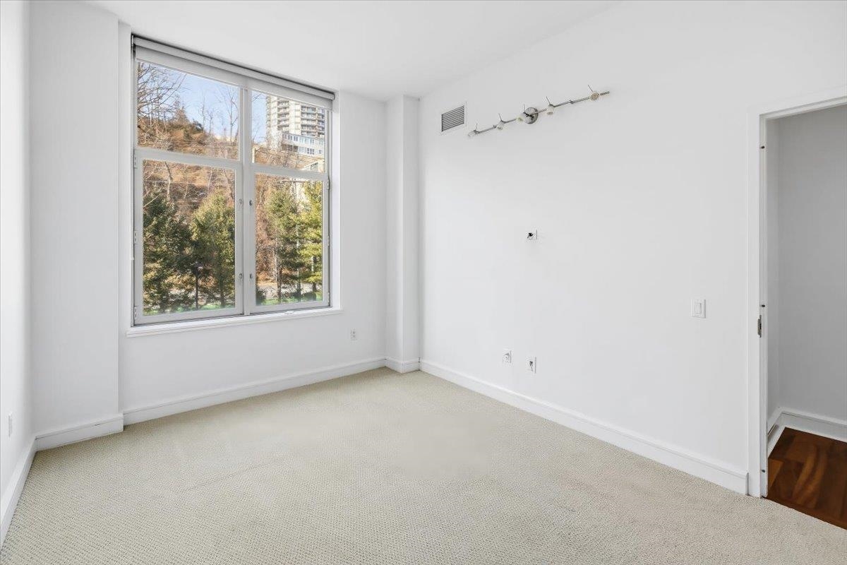 8100 River Road, Unit 209 North Bergen, NJ 07047 - Photo 10 of 42 a view of an empty room with a window