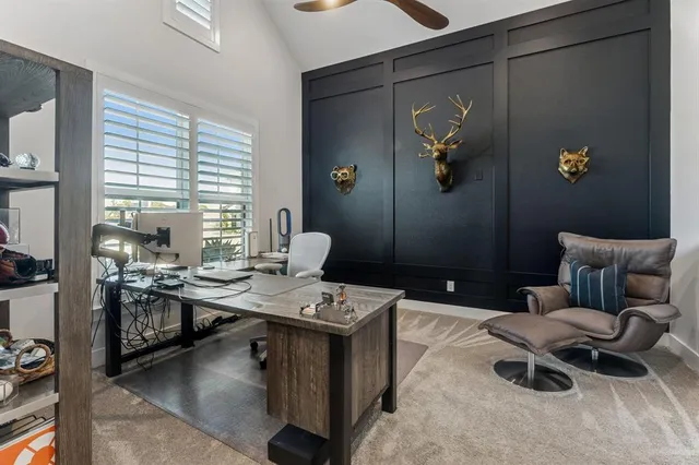 a living room with furniture a rug and a large window