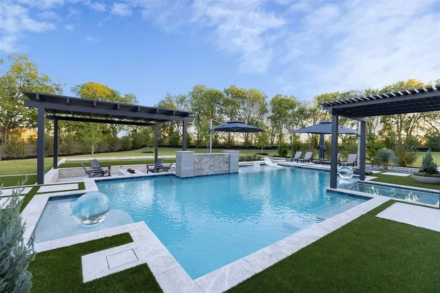 a view of a swimming pool with a patio