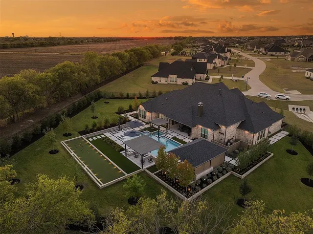 an aerial view of a house with a lake view