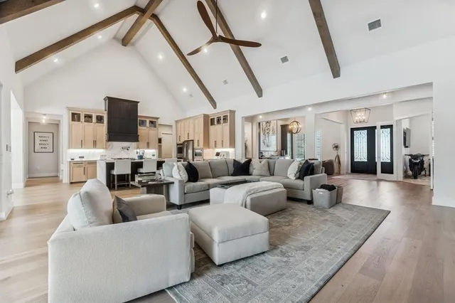 a living room with fireplace furniture and a flat screen tv