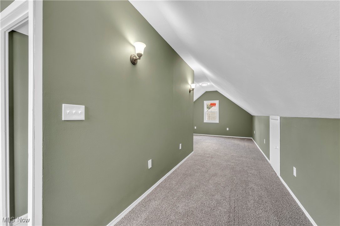 20813 Hansen Road Maple Heights, OH 44137 - Photo 23 of 40 Additional living space with carpet flooring and lofted ceiling