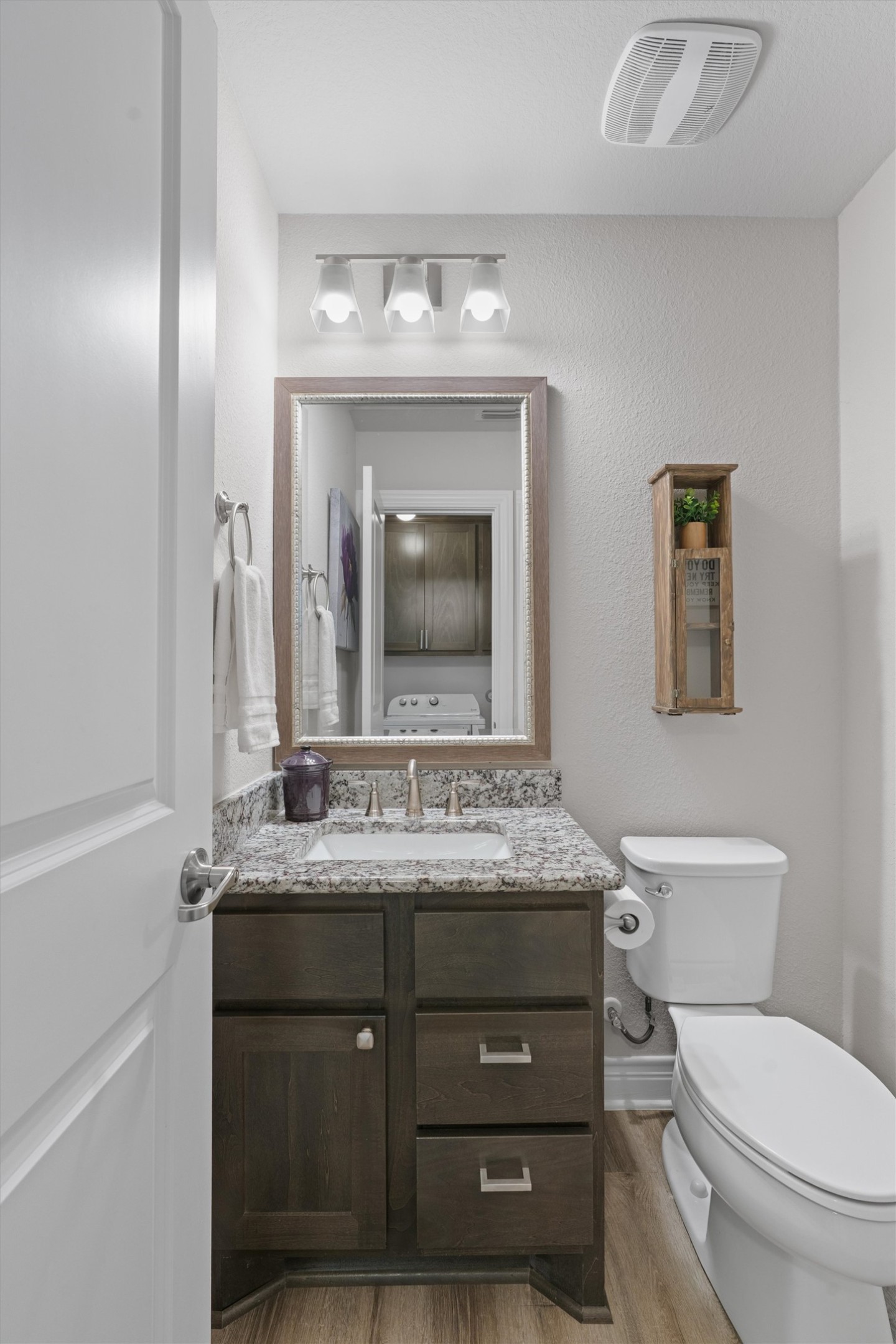 4651 Fm 972 Georgetown, TX 78626 - Photo 13 of 40 a bathroom with a granite countertop toilet sink and mirror