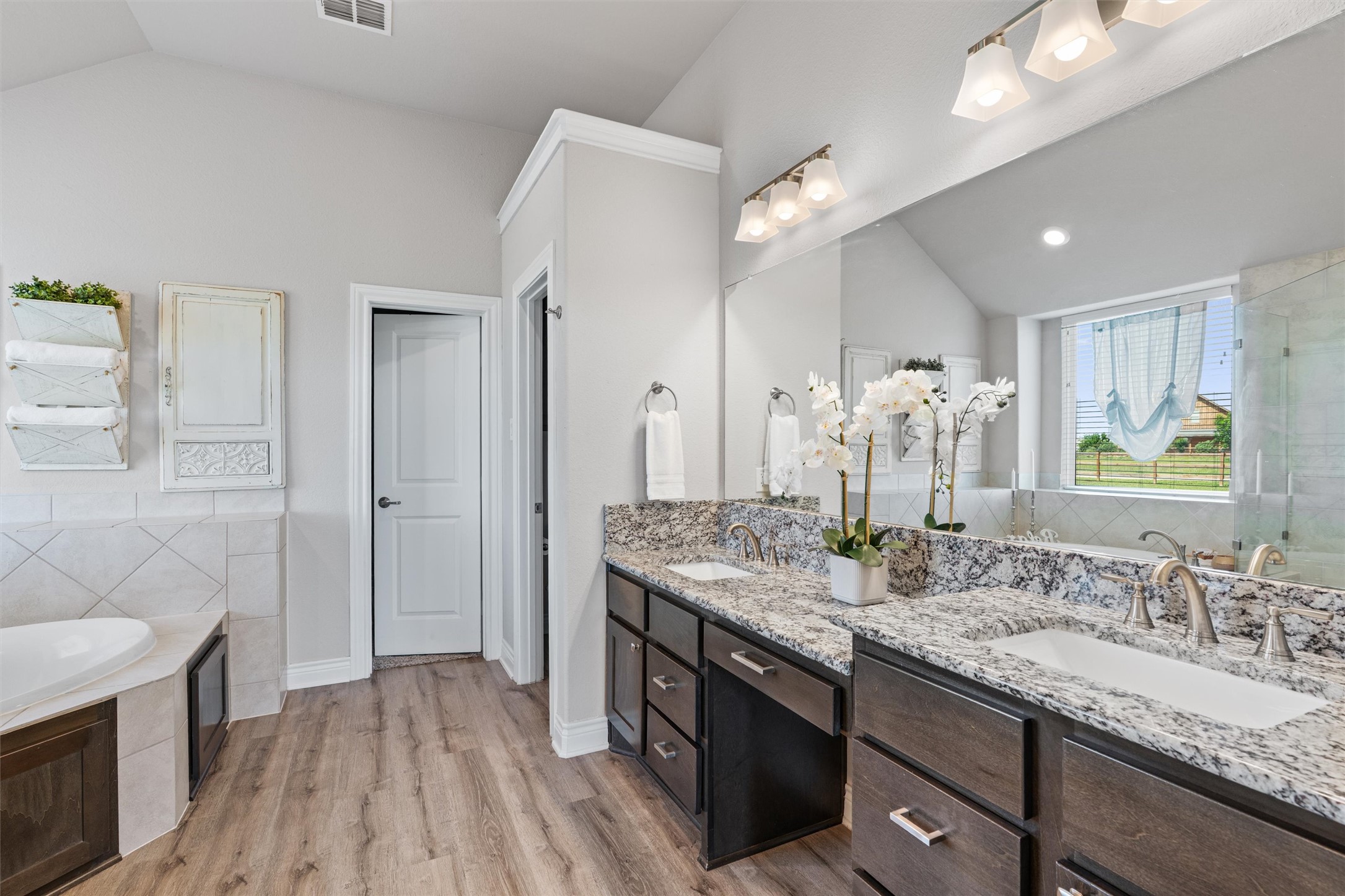 4651 Fm 972 Georgetown, TX 78626 - Photo 16 of 40 a bathroom with a granite countertop double vanity sink a mirror and shower