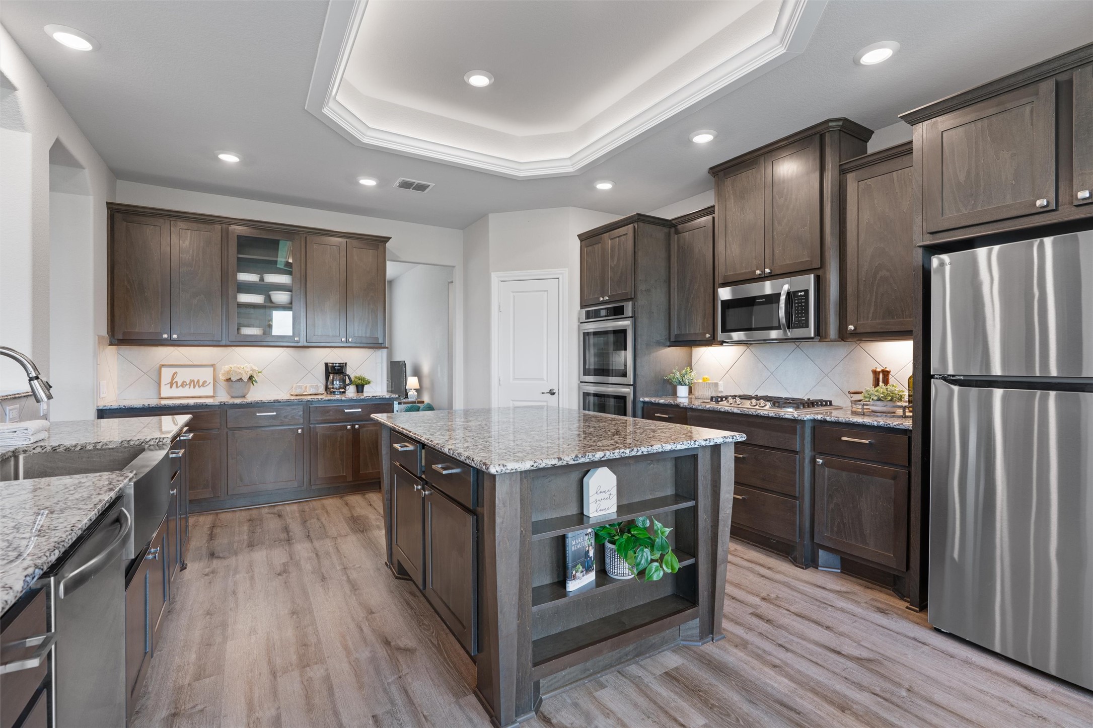 4651 Fm 972 Georgetown, TX 78626 - Photo 9 of 40 a large kitchen with stainless steel appliances granite countertop plenty wooden cabinets counter space and wooden floor