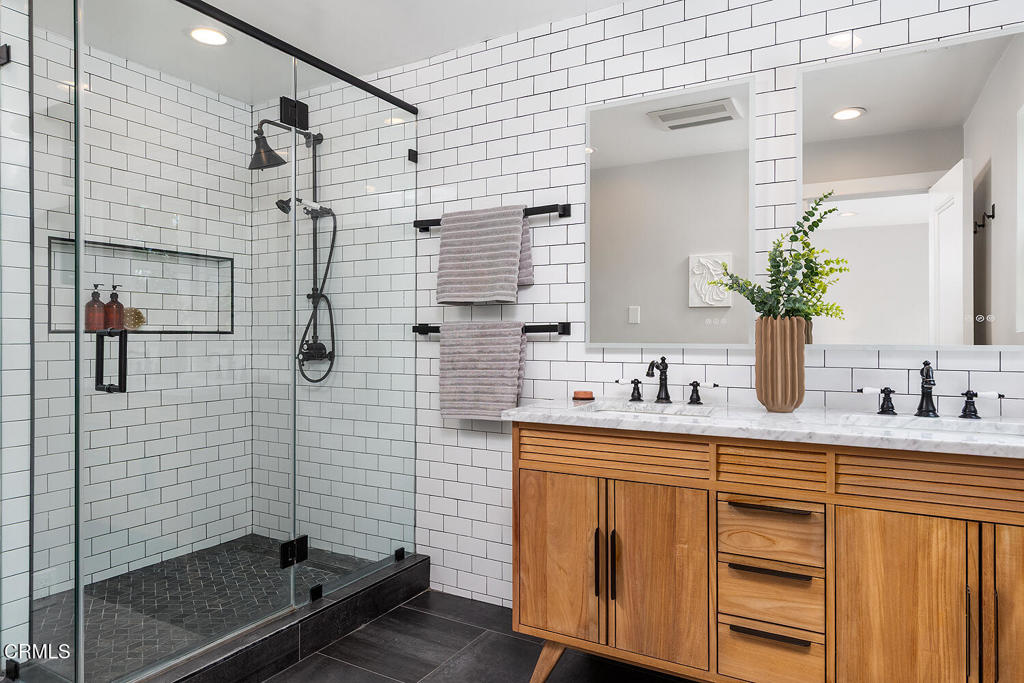 2040 North Madison Avenue Altadena, CA 91001 - Photo 20 of 35 a bathroom with a sink a mirror and shower