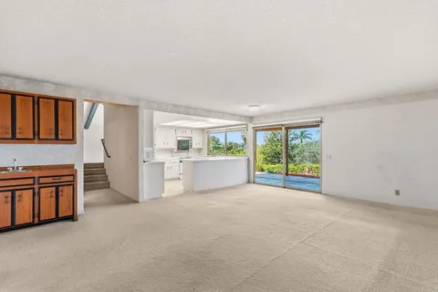 a kitchen with stainless steel appliances a refrigerator sink and cabinets