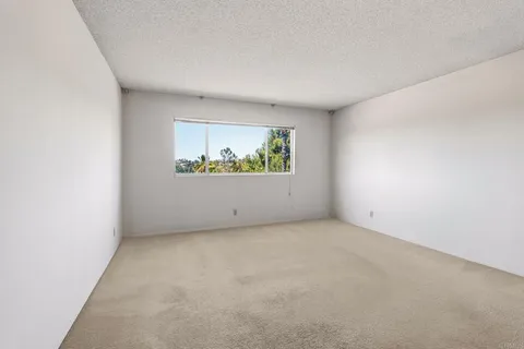 a view of a bathroom with a shower and closet