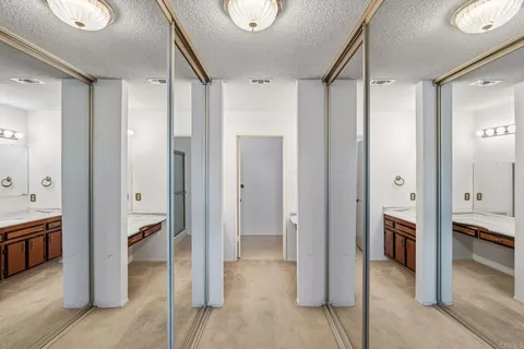 a bathroom with a sink a vanity and a mirror