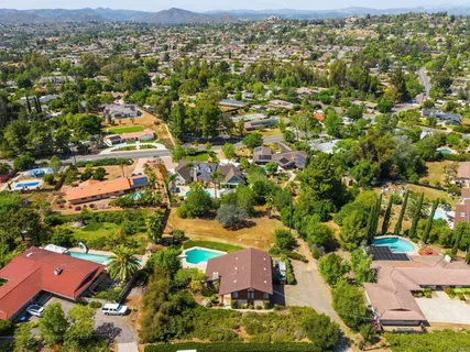 an aerial view of residential houses with outdoor space