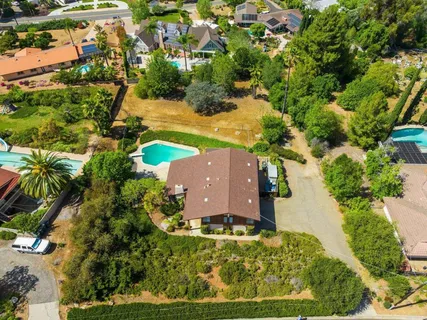 an aerial view of a house with a garden