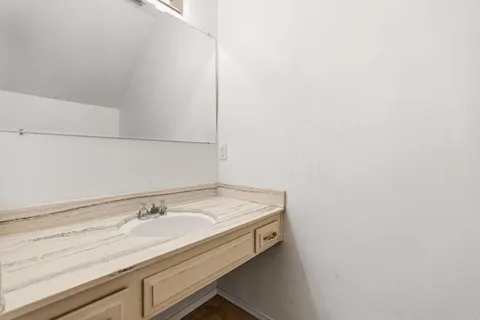 an empty room with fireplace and windows