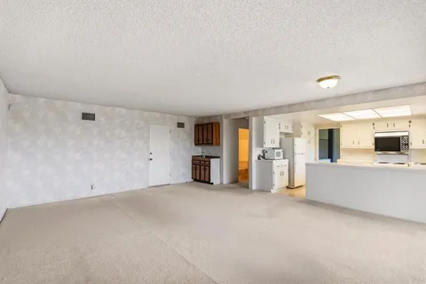 a view of a kitchen with a sink cabinets and a window