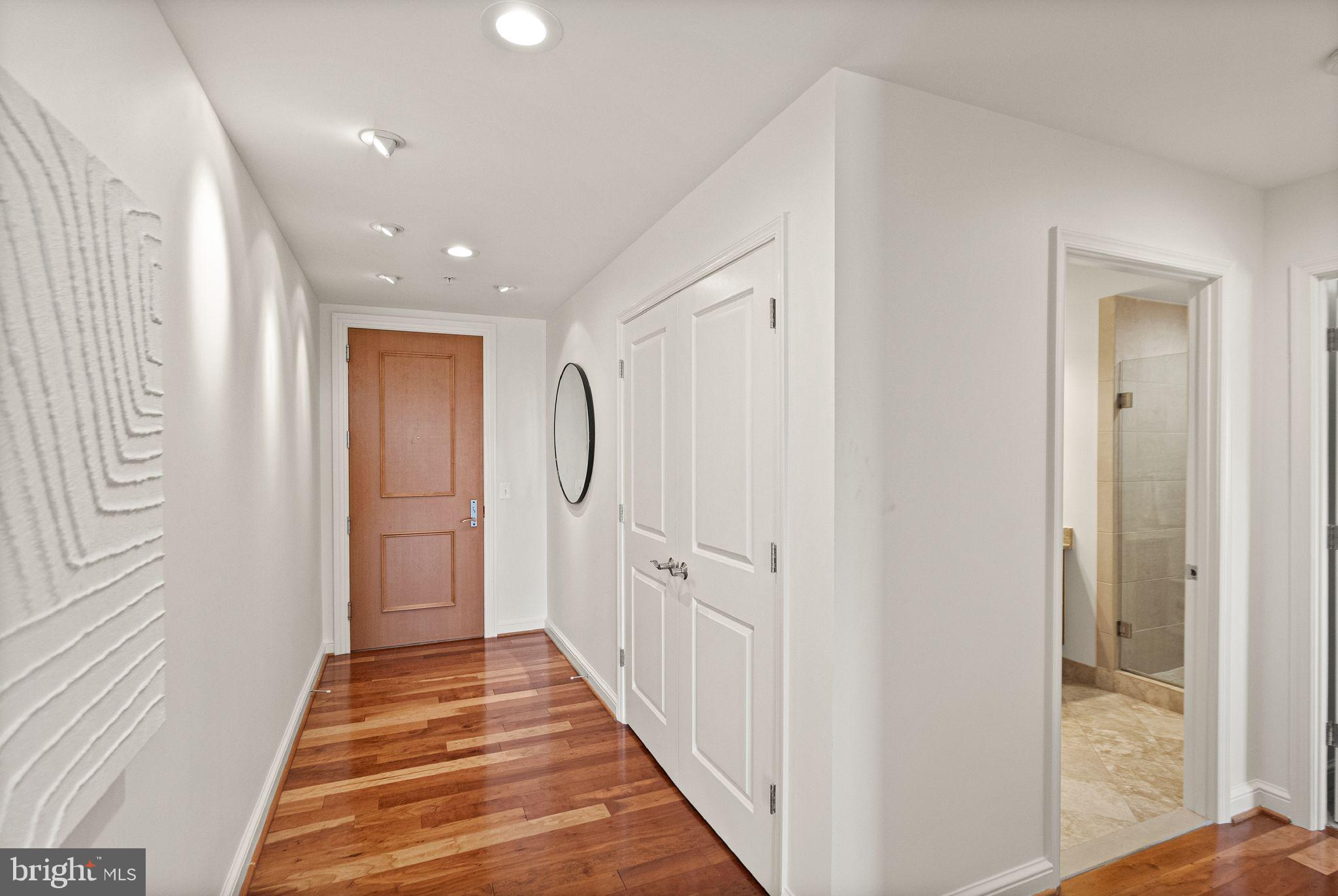 11990 Market Street, Unit 1015 Reston, VA 20190 - Photo 11 of 90 a view of a hallway with wooden floor and staircase