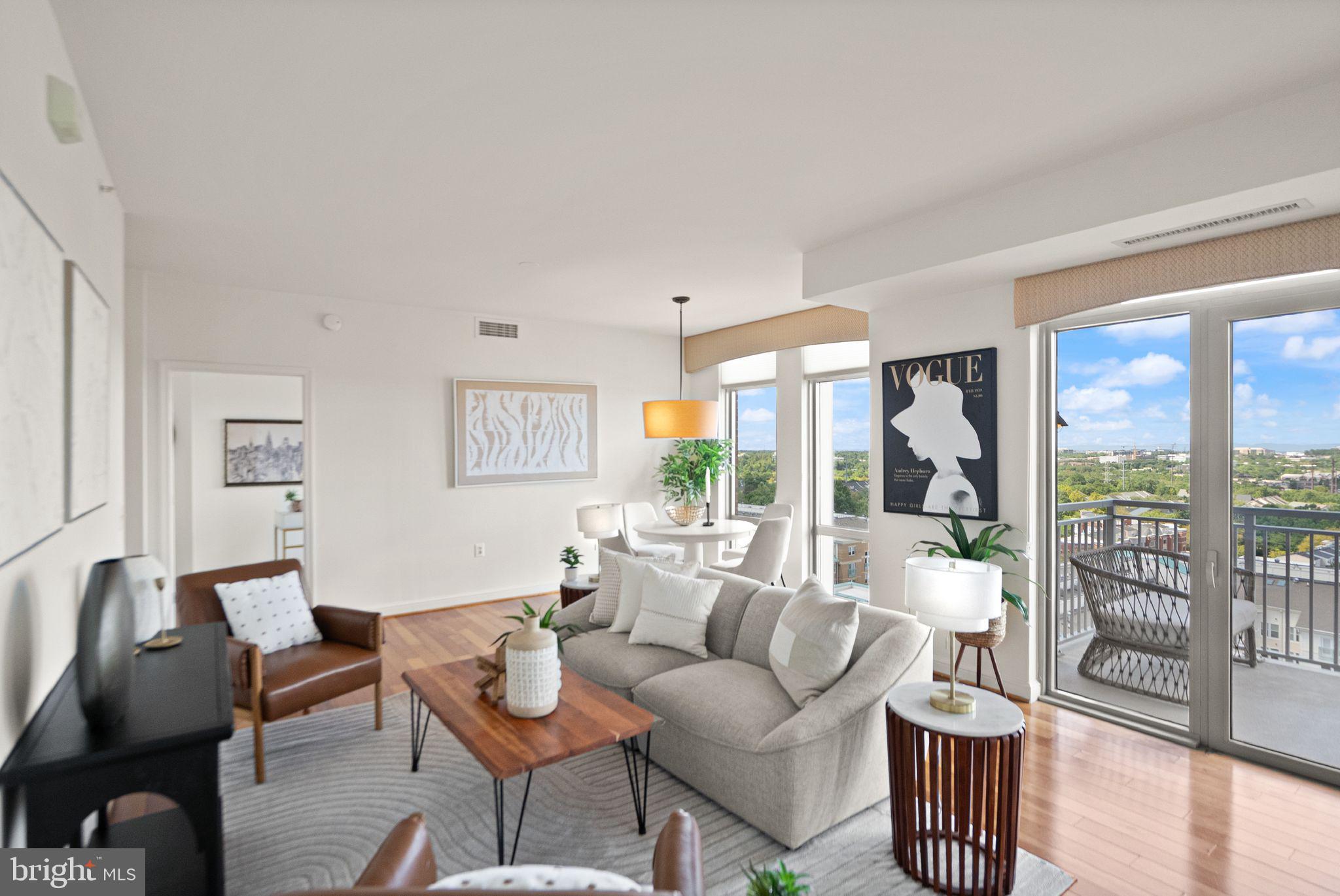 11990 Market Street, Unit 1015 Reston, VA 20190 - Photo 17 of 90 a living room with furniture and a large window