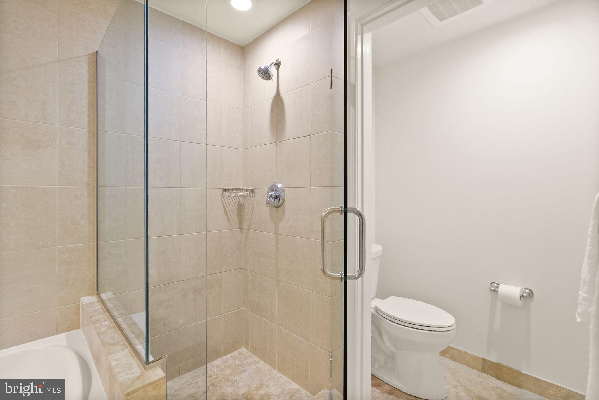 11990 Market Street, Unit 1015 Reston, VA 20190 - Photo 36 of 90 a bathroom with a toilet and a shower