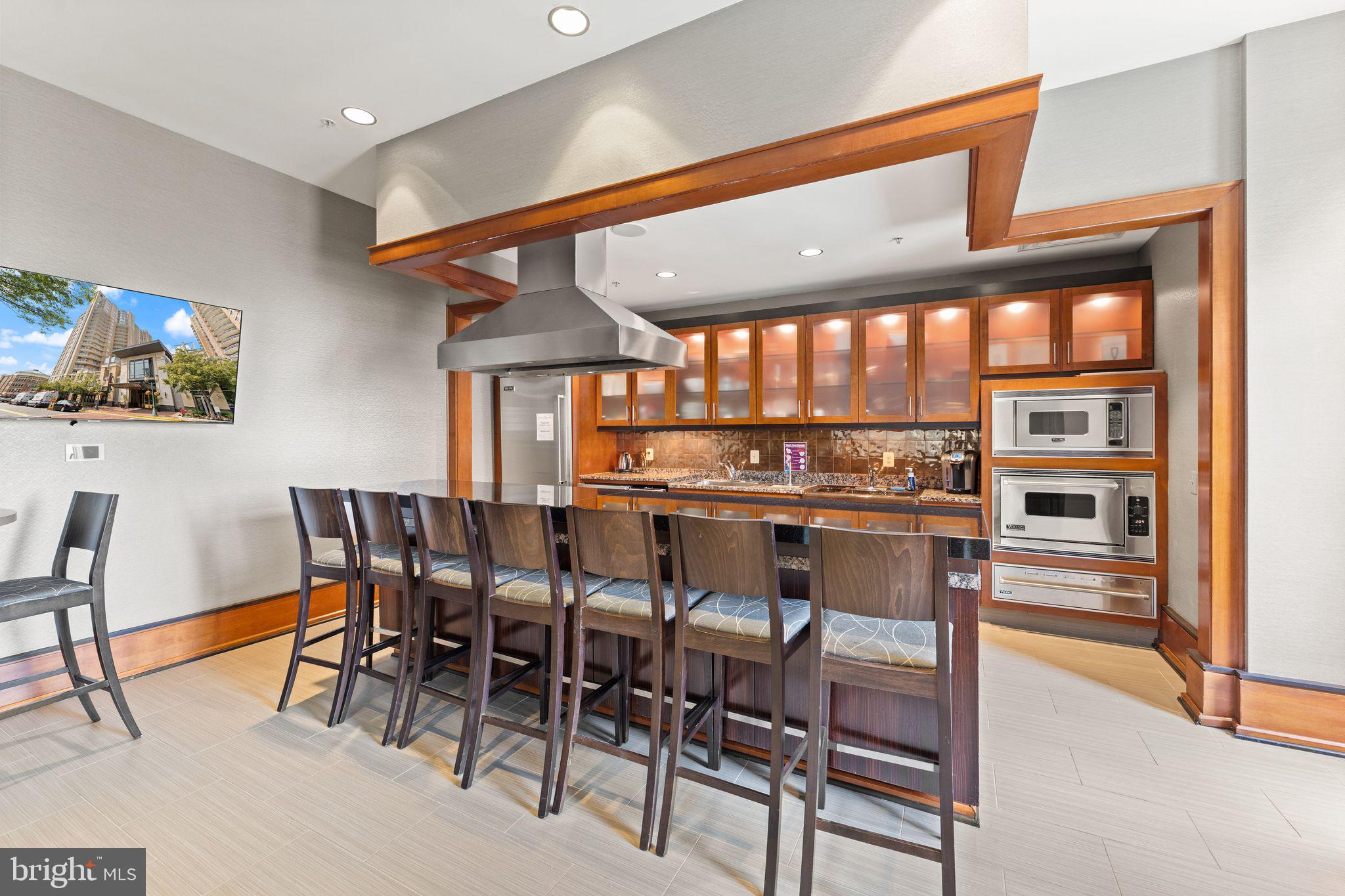 11990 Market Street, Unit 1015 Reston, VA 20190 - Photo 65 of 90 a kitchen with a table and chairs in it