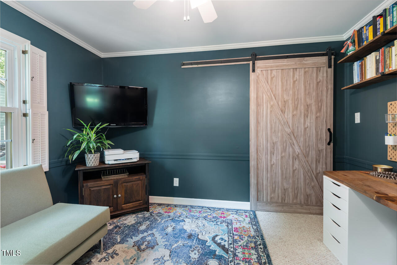7324 Old Hundred Road Raleigh, NC 27613 - Photo 19 of 92 a living room with furniture and a flat screen tv