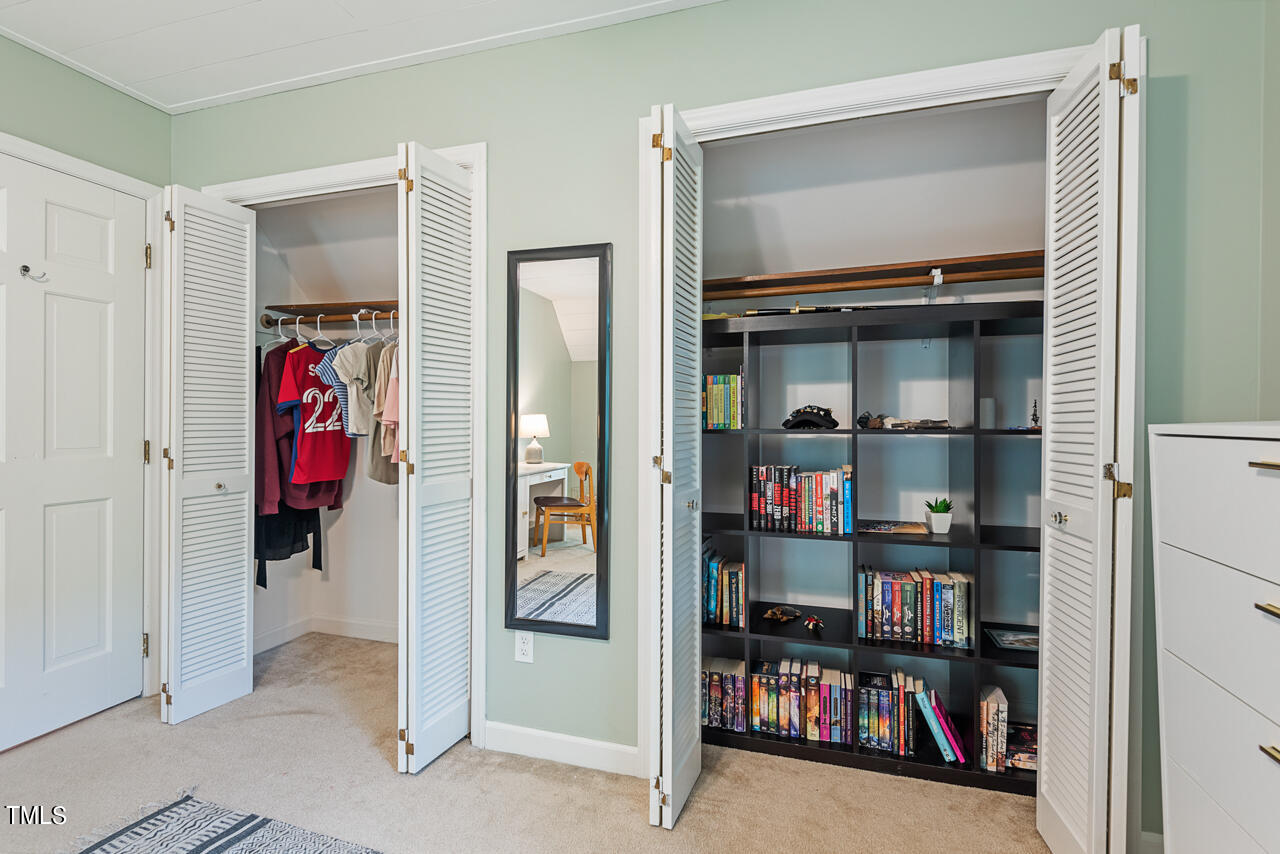 7324 Old Hundred Road Raleigh, NC 27613 - Photo 46 of 92 a view of walk in closet with clothes and shoes
