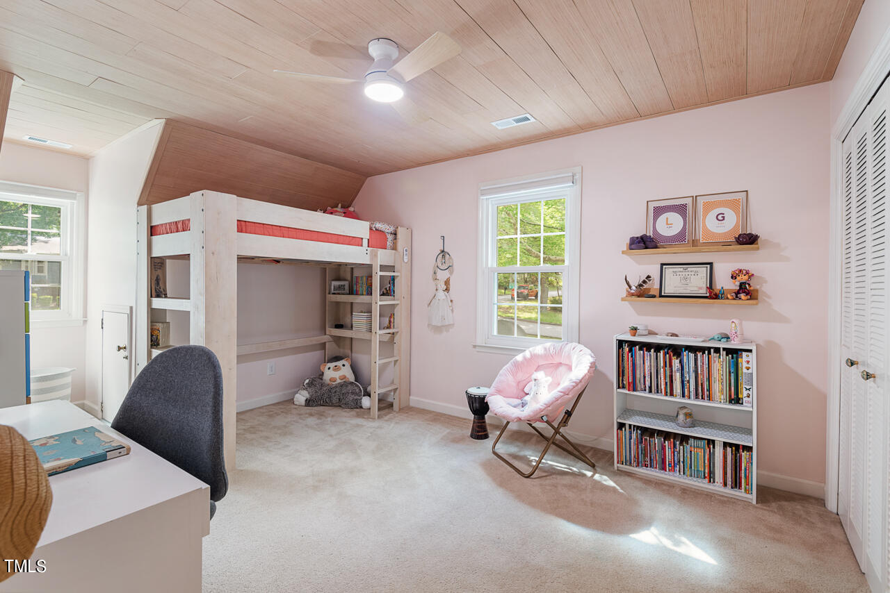 7324 Old Hundred Road Raleigh, NC 27613 - Photo 48 of 92 a living room with furniture and a book shelf