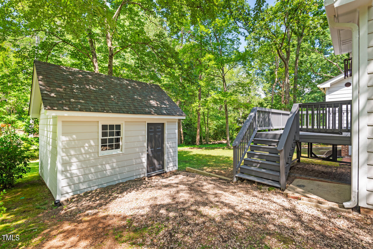 7324 Old Hundred Road Raleigh, NC 27613 - Photo 66 of 92 a view of a house with backyard and wooden fence