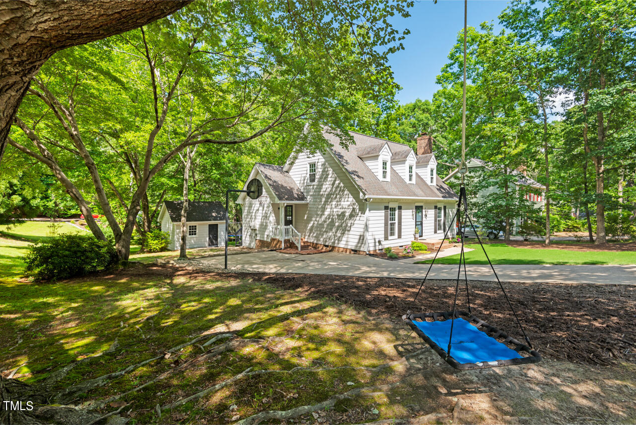 7324 Old Hundred Road Raleigh, NC 27613 - Photo 68 of 92 a view of a house with backyard and a tree