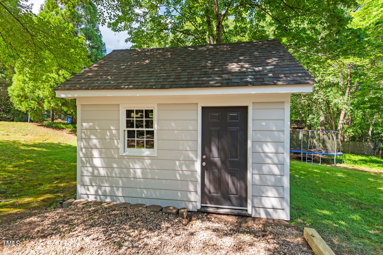 7324 Old Hundred Road Raleigh, NC 27613 - Photo 69 of 92 a front view of a house with garden