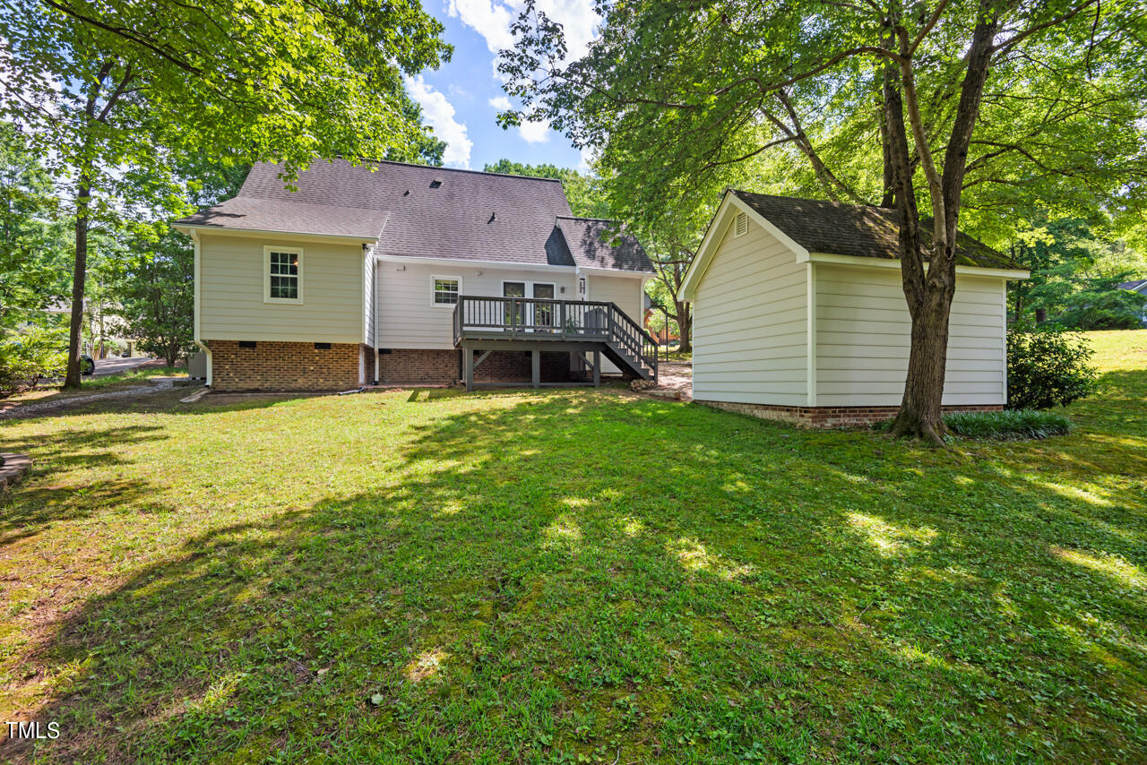 7324 Old Hundred Road Raleigh, NC 27613 - Photo 73 of 92 a view of a house with a yard and sitting area