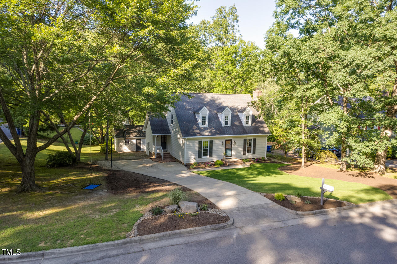 7324 Old Hundred Road Raleigh, NC 27613 - Photo 82 of 92 a front view of a house with a yard