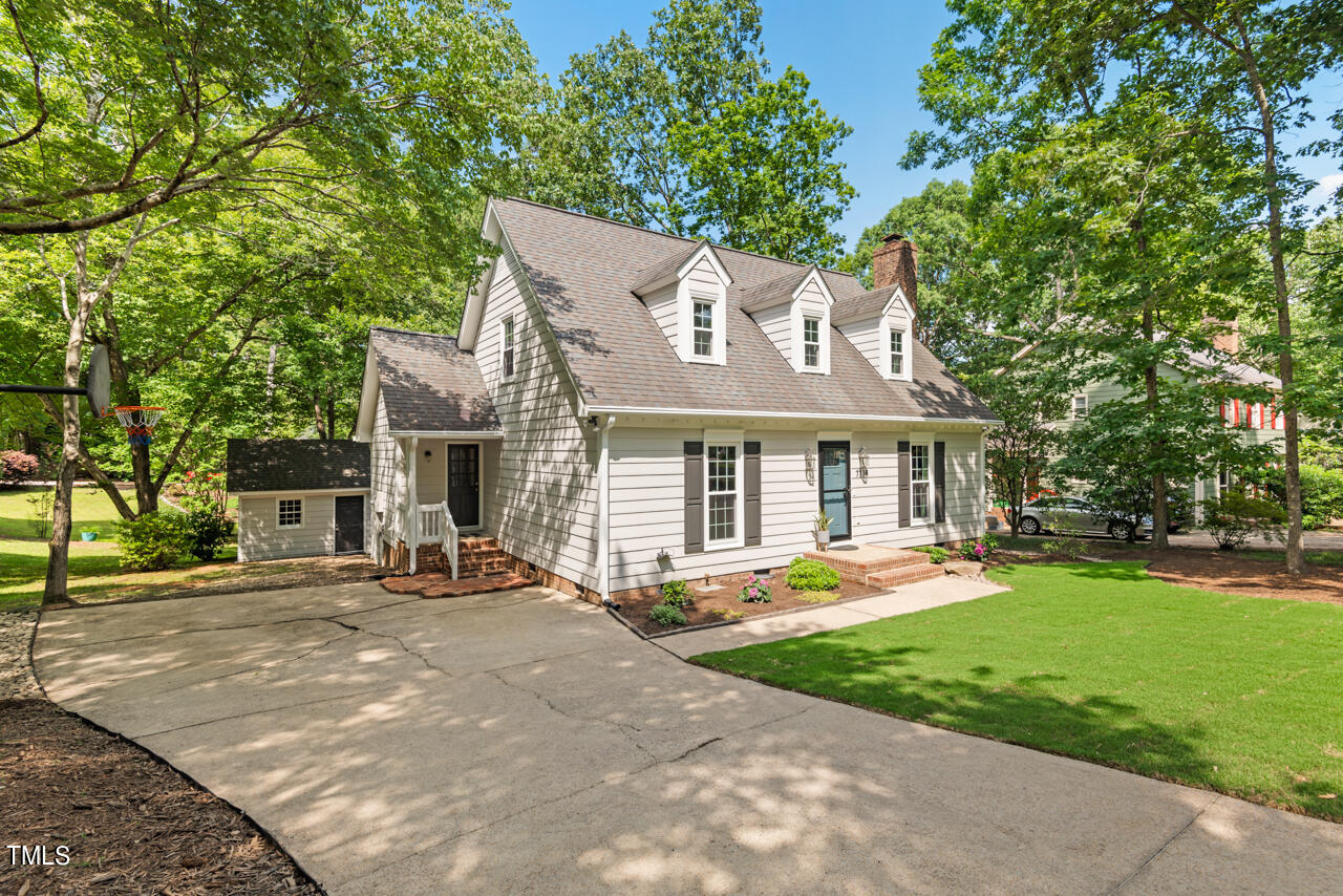 7324 Old Hundred Road Raleigh, NC 27613 - Photo 89 of 92 a front view of a house with a yard table and chairs