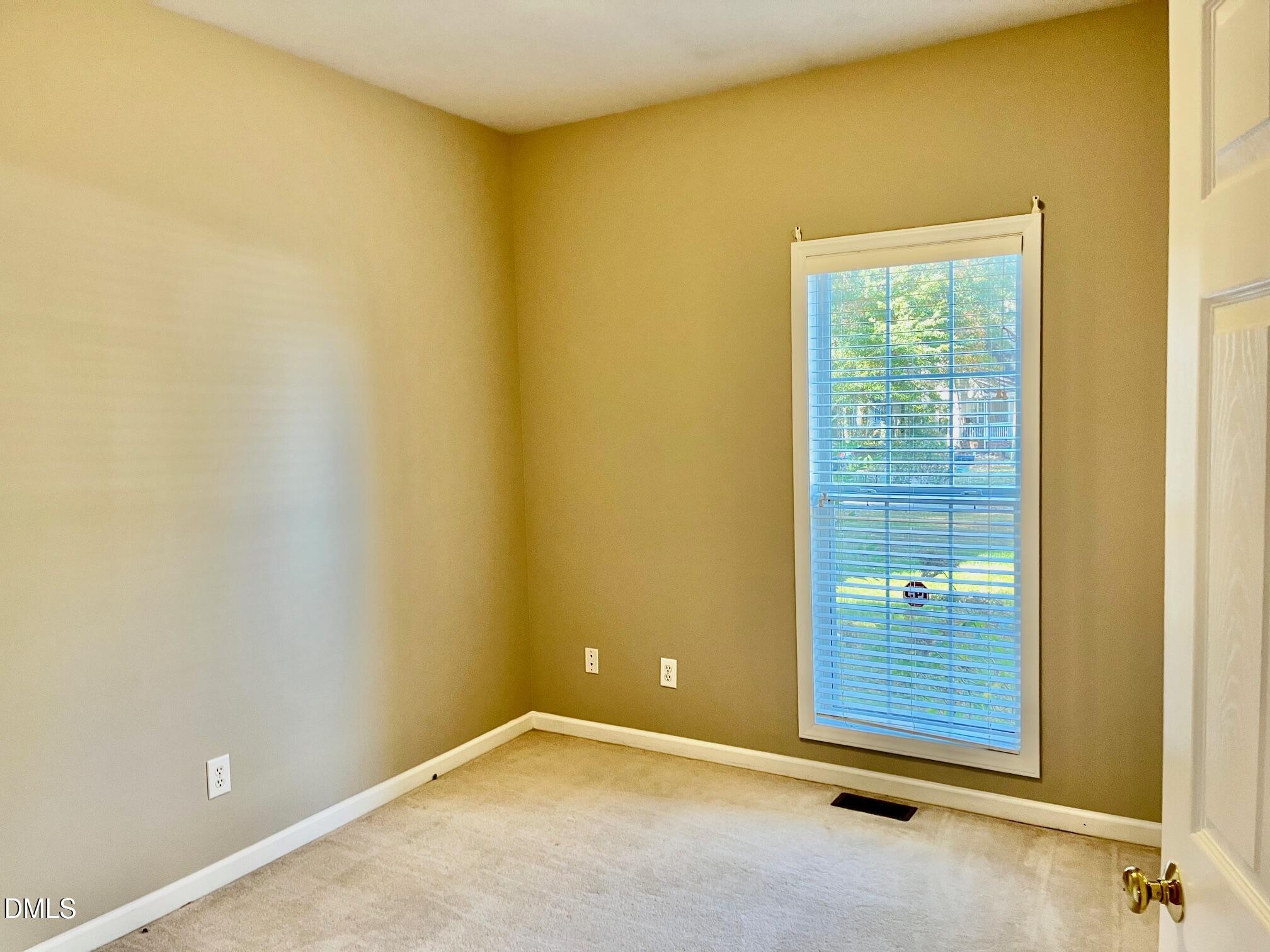 3027 Rennit Court Raleigh, NC 27603 - Photo 15 of 29 an empty room with windows
