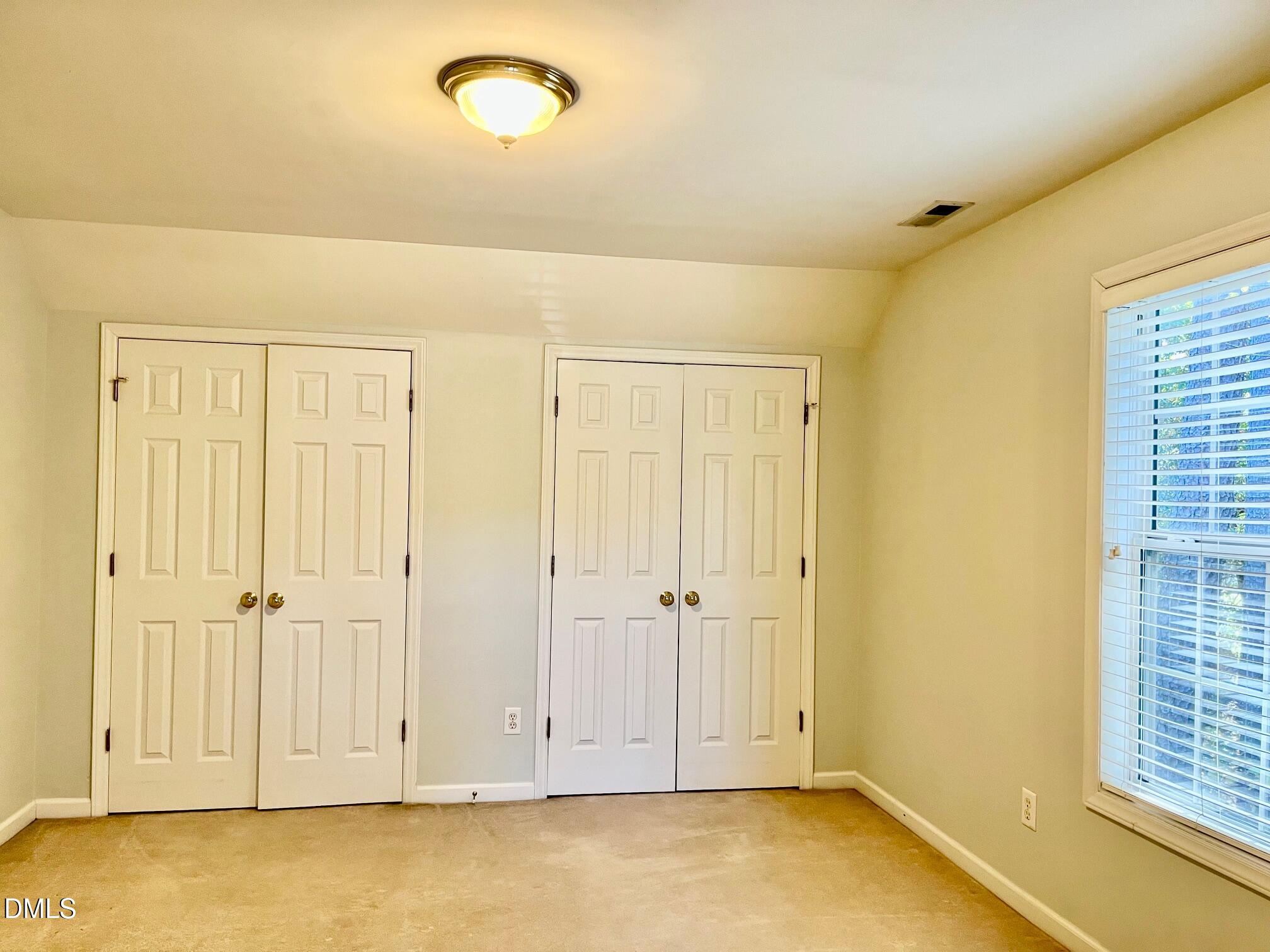 3027 Rennit Court Raleigh, NC 27603 - Photo 19 of 29 an empty room with windows