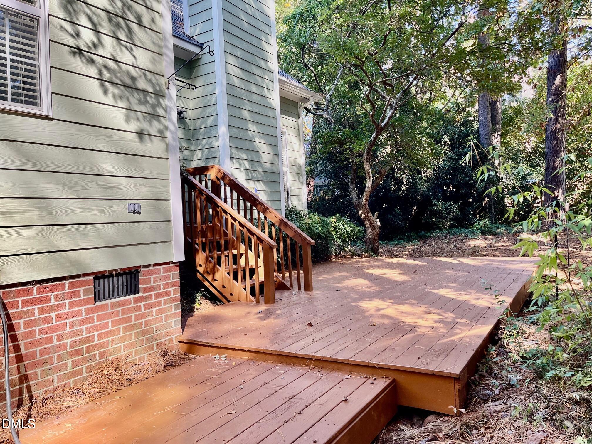 3027 Rennit Court Raleigh, NC 27603 - Photo 26 of 29 a view of a patio with a table and chairs