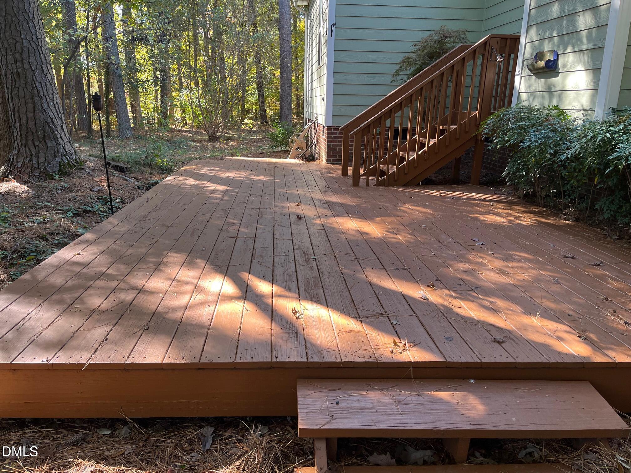 3027 Rennit Court Raleigh, NC 27603 - Photo 27 of 29 a view of backyard with deck and trees