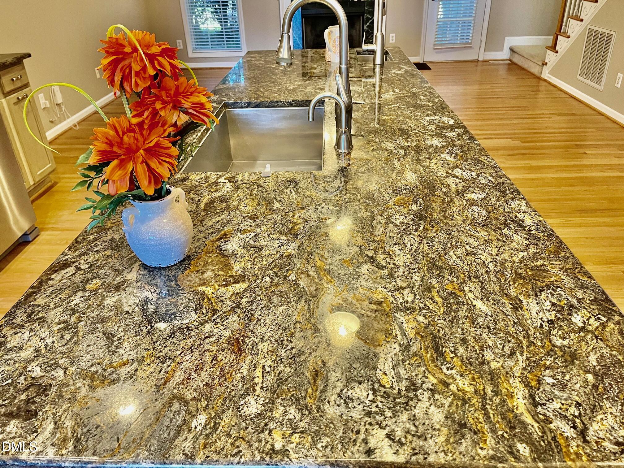 3027 Rennit Court Raleigh, NC 27603 - Photo 6 of 29 a vase of flowers sitting on a table