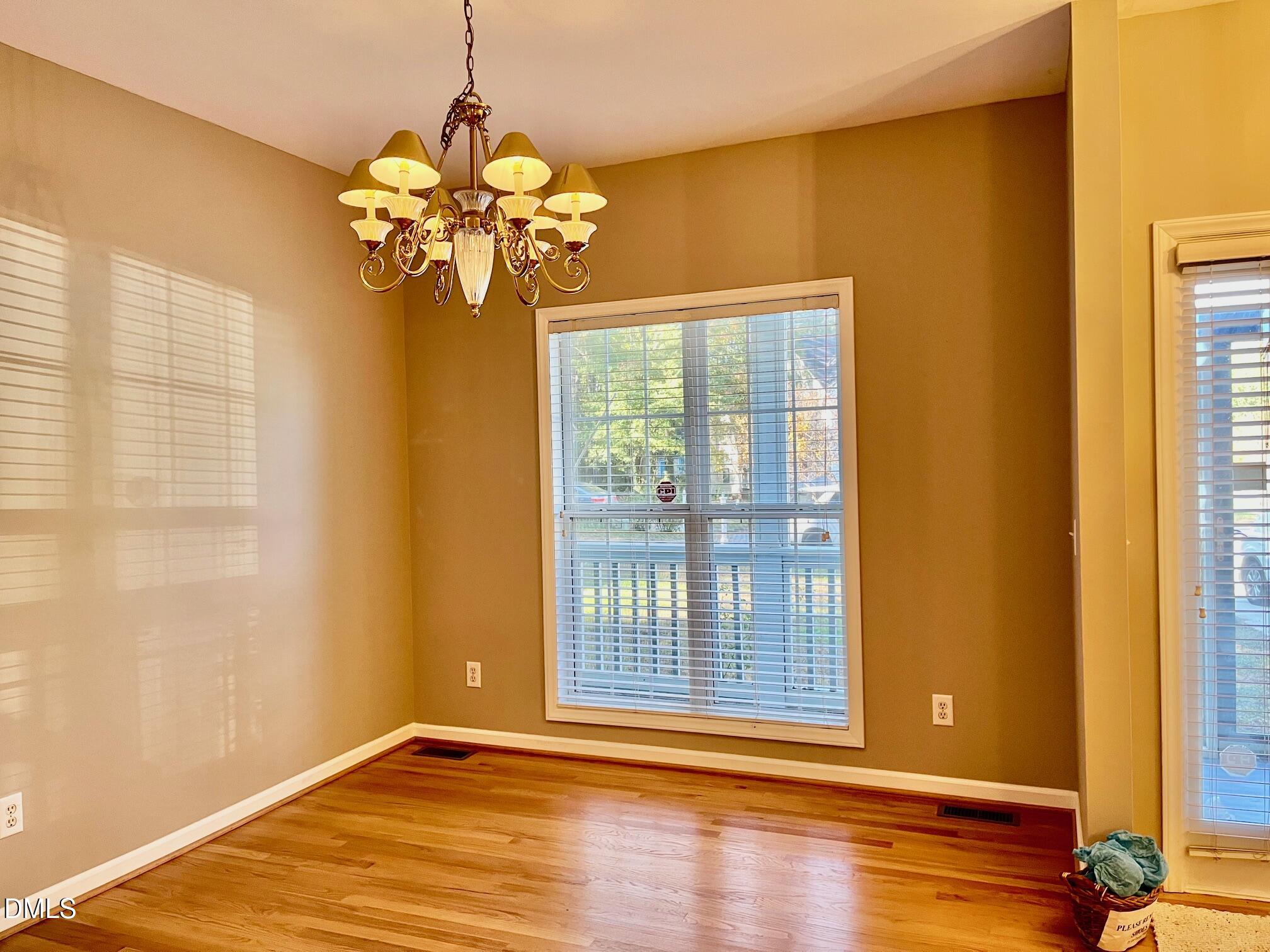 3027 Rennit Court Raleigh, NC 27603 - Photo 7 of 29 a view of a room with window and wooden floor