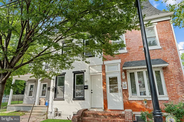 front view of a house with a tree
