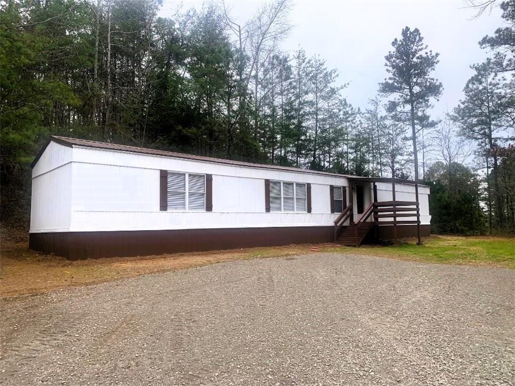 163 Pine Hill Road Southeast Rydal, GA 30171 - Photo 1 of 1 a front view of a house with garden