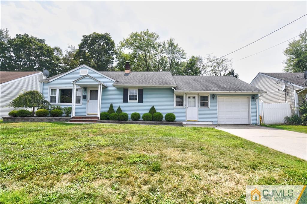 15 Burnham Road East Brunswick, NJ 08816 - Photo 2 of 16 a front view of a house with a garden