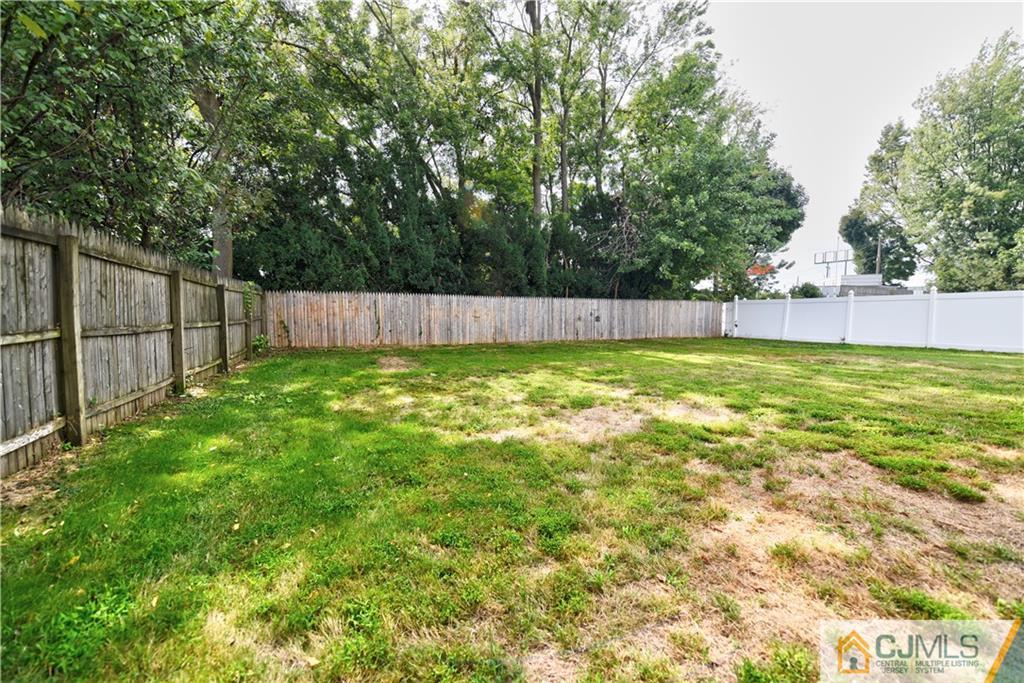 15 Burnham Road East Brunswick, NJ 08816 - Photo 16 of 16 a view of a swimming pool and a yard