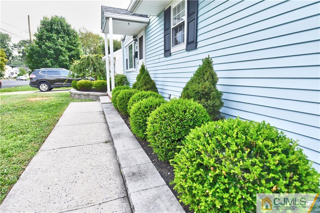 15 Burnham Road East Brunswick, NJ 08816 - Photo 3 of 16 a view of a garden with pathway