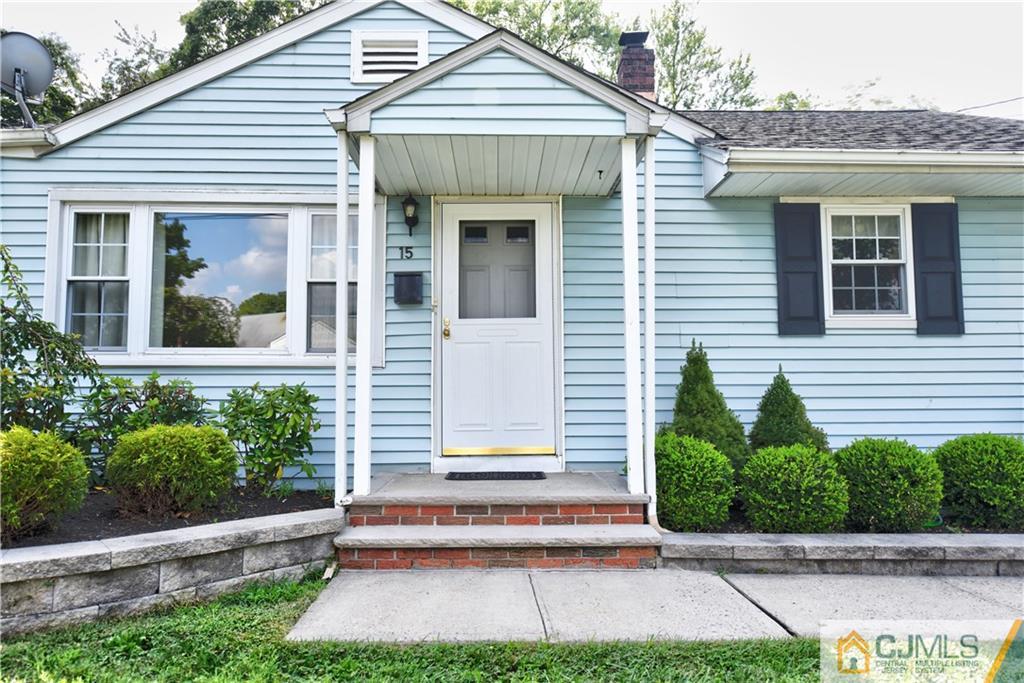 15 Burnham Road East Brunswick, NJ 08816 - Photo 4 of 16 a front view of a house with a yard