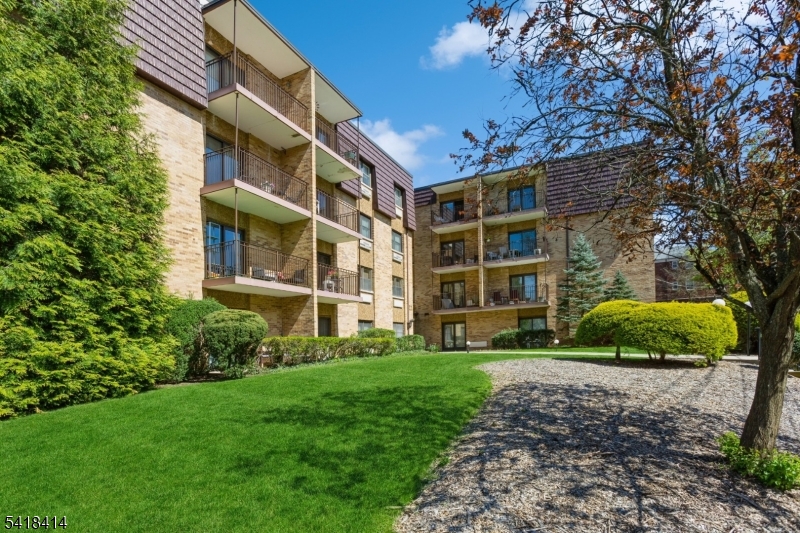 a view of a building with a yard