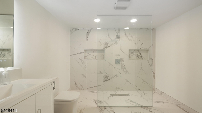 22 Riverside Drive, Unit B 7 Cranford, NJ 07016 - Photo 14 of 24 a bathroom with a shower a toilet and a shower