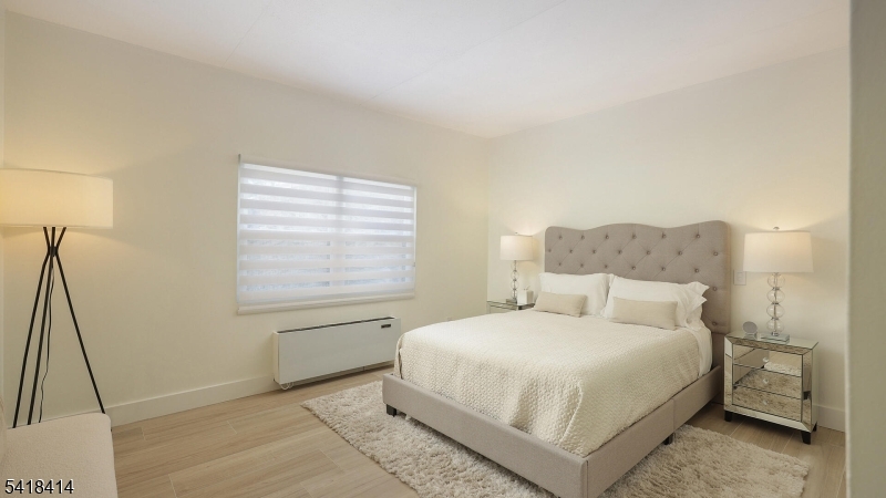 22 Riverside Drive, Unit B 7 Cranford, NJ 07016 - Photo 16 of 24 a bedroom with a bed and a window