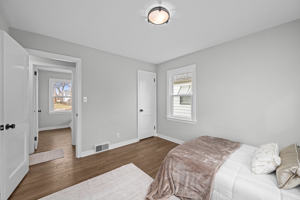 2036 46th Street Rock Island, IL 61201 - Photo 12 of 24 a bedroom with a bed and a window