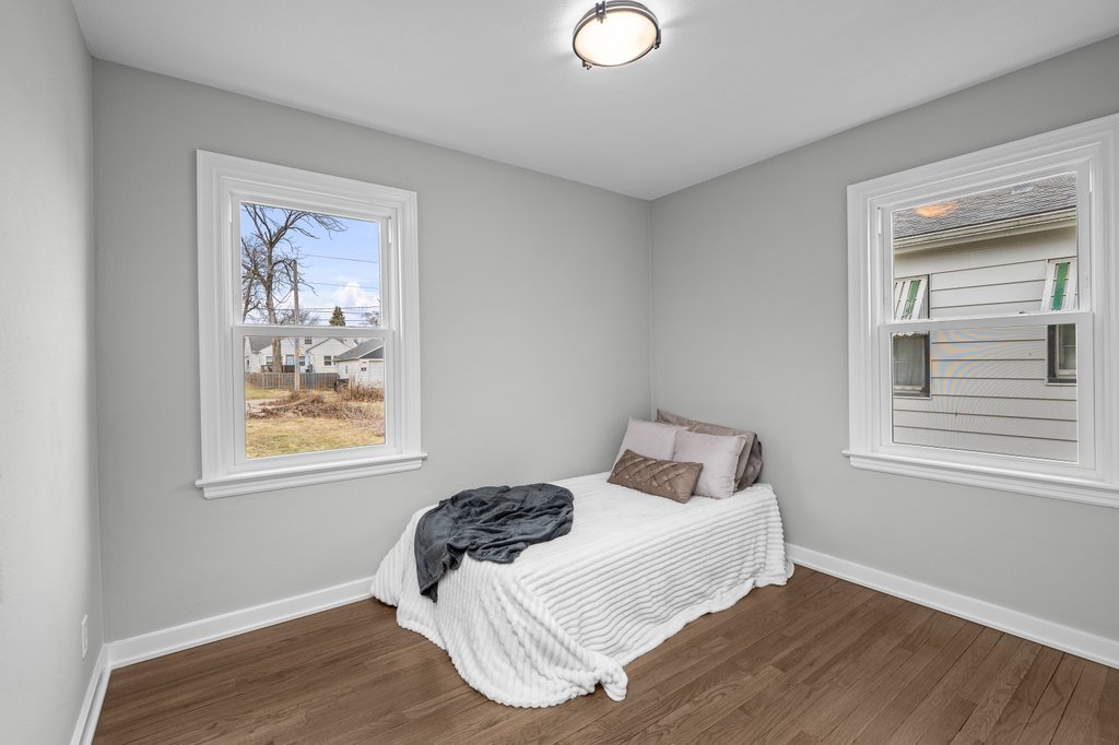2036 46th Street Rock Island, IL 61201 - Photo 13 of 24 a bedroom with a bed and a window