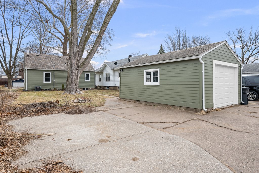 2036 46th Street Rock Island, IL 61201 - Photo 18 of 24 a front view of a house with a yard covered in snow