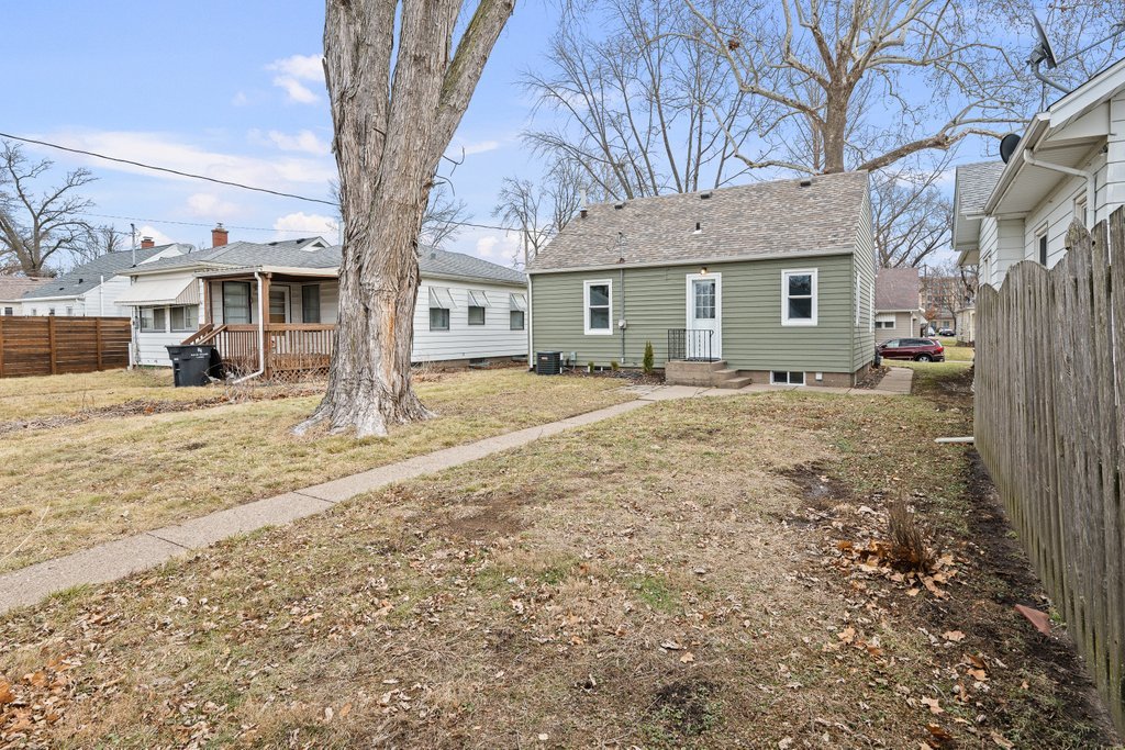 2036 46th Street Rock Island, IL 61201 - Photo 20 of 24 a view of a house with a yard covered in snow
